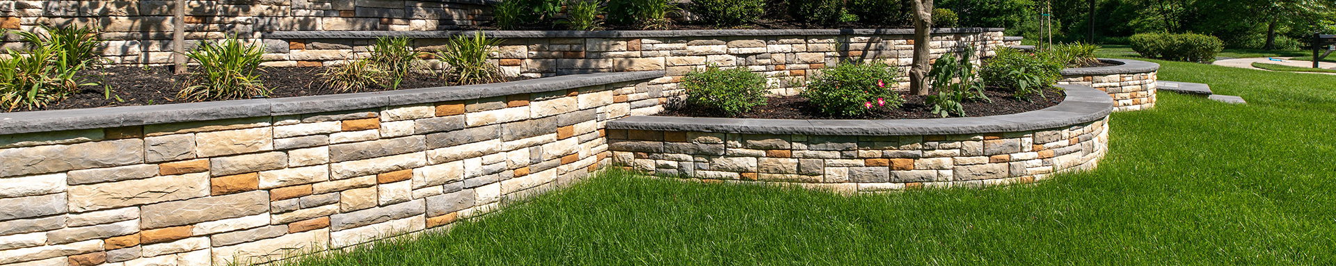 Photo of a retaining wall and landscaping at a Northwest Arkansas home