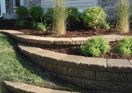 Photo of a NWA retaining wall leveling off sloped landscape at a Northwest Arkansas home